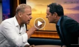 To mænd i et studie diskuterer intenst ansigt til ansigt; den ene peger med fingeren, mens den anden læner sig frem. Den ophedede scene, der er sat op mod et bybillede med aftenbelysning, antyder et sammenstød om hurtige penge eller et diskutabelt Google-søgeresultat.